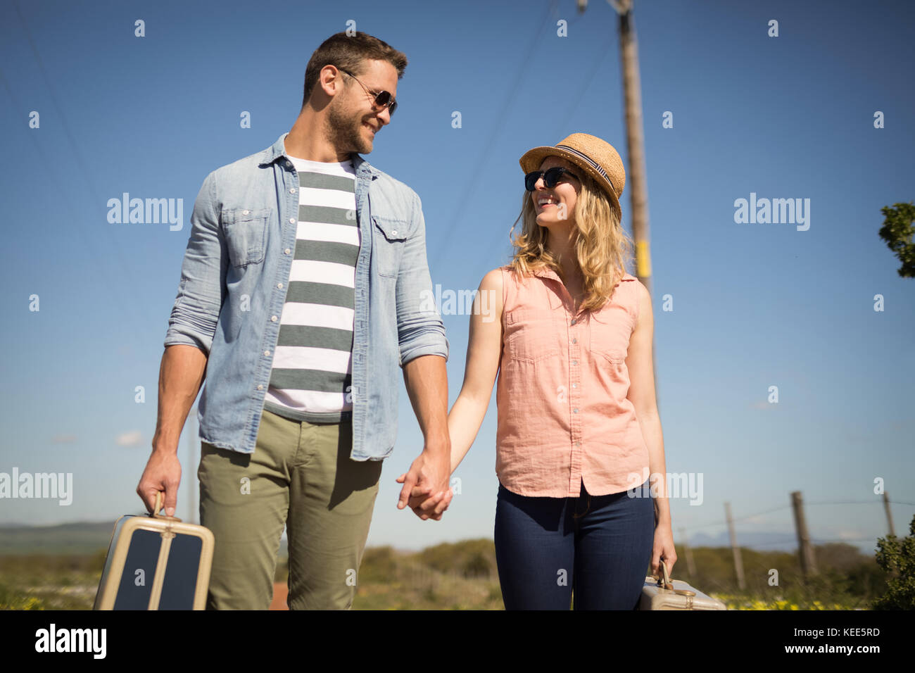 Happy man walking luggage hi-res stock photography and images - Alamy