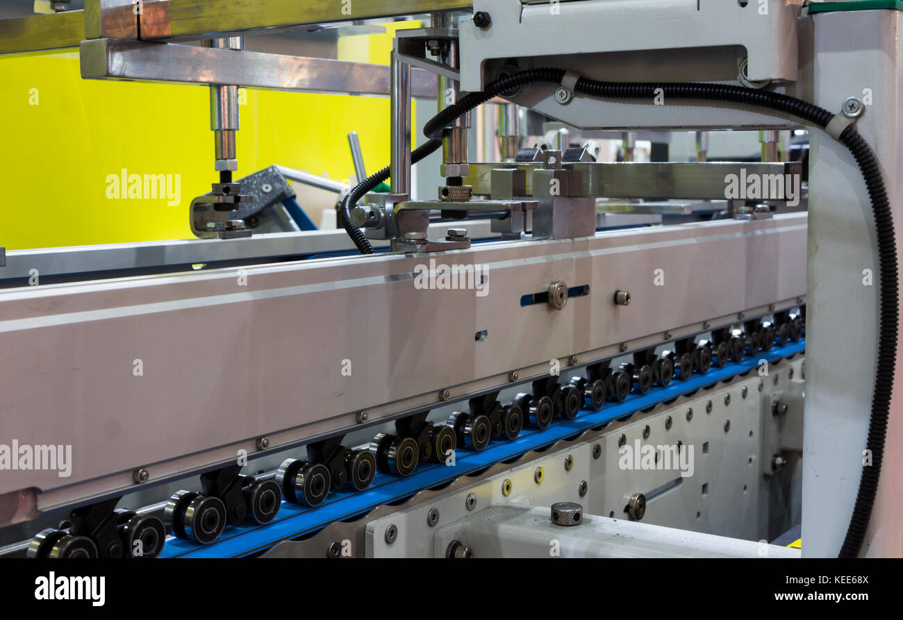 detail of a folder gluer machine for carton box Stock Photo - Alamy