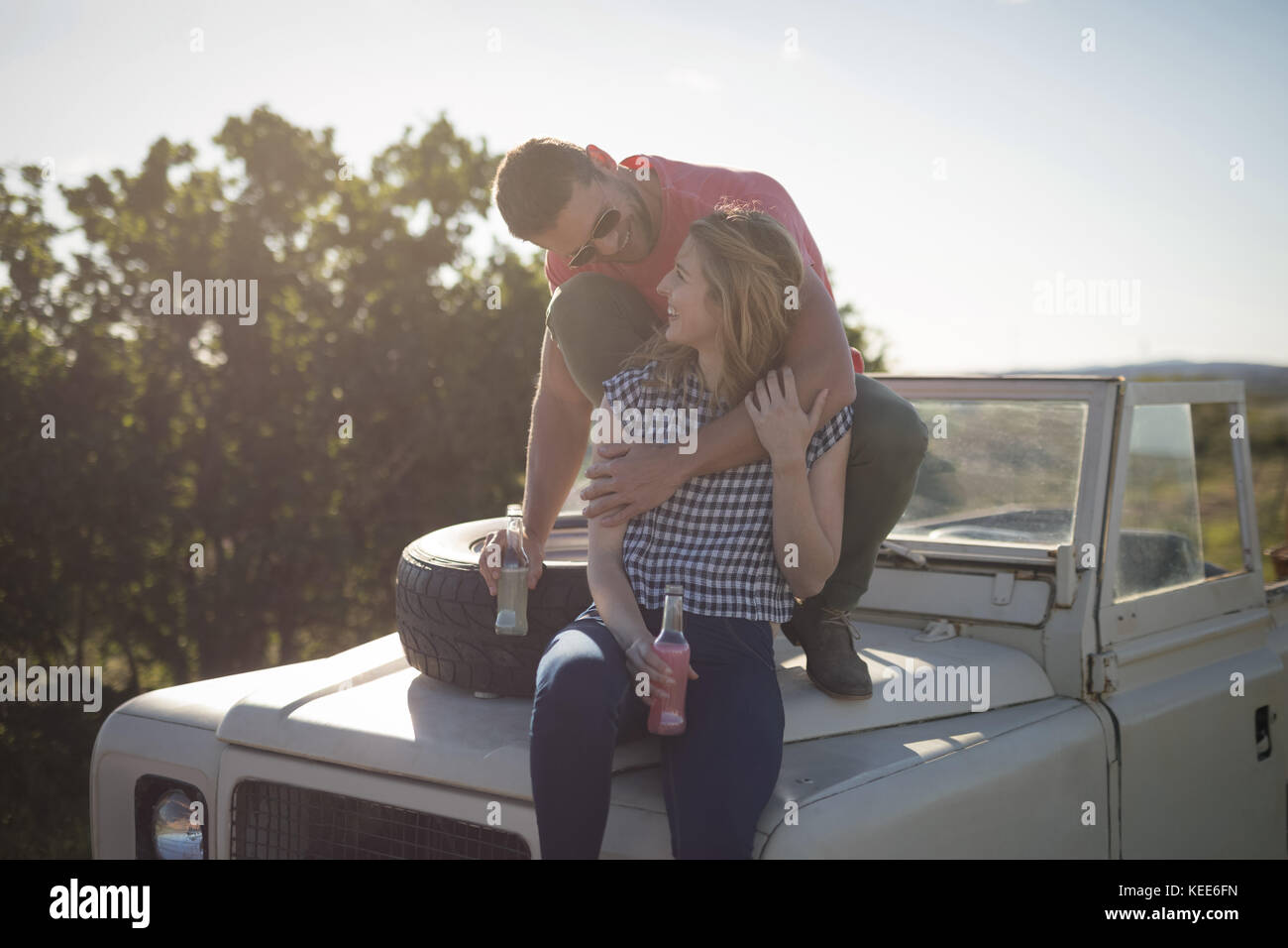 Young Couple Sitting On Bonnet Parked Stock Photo 215278807