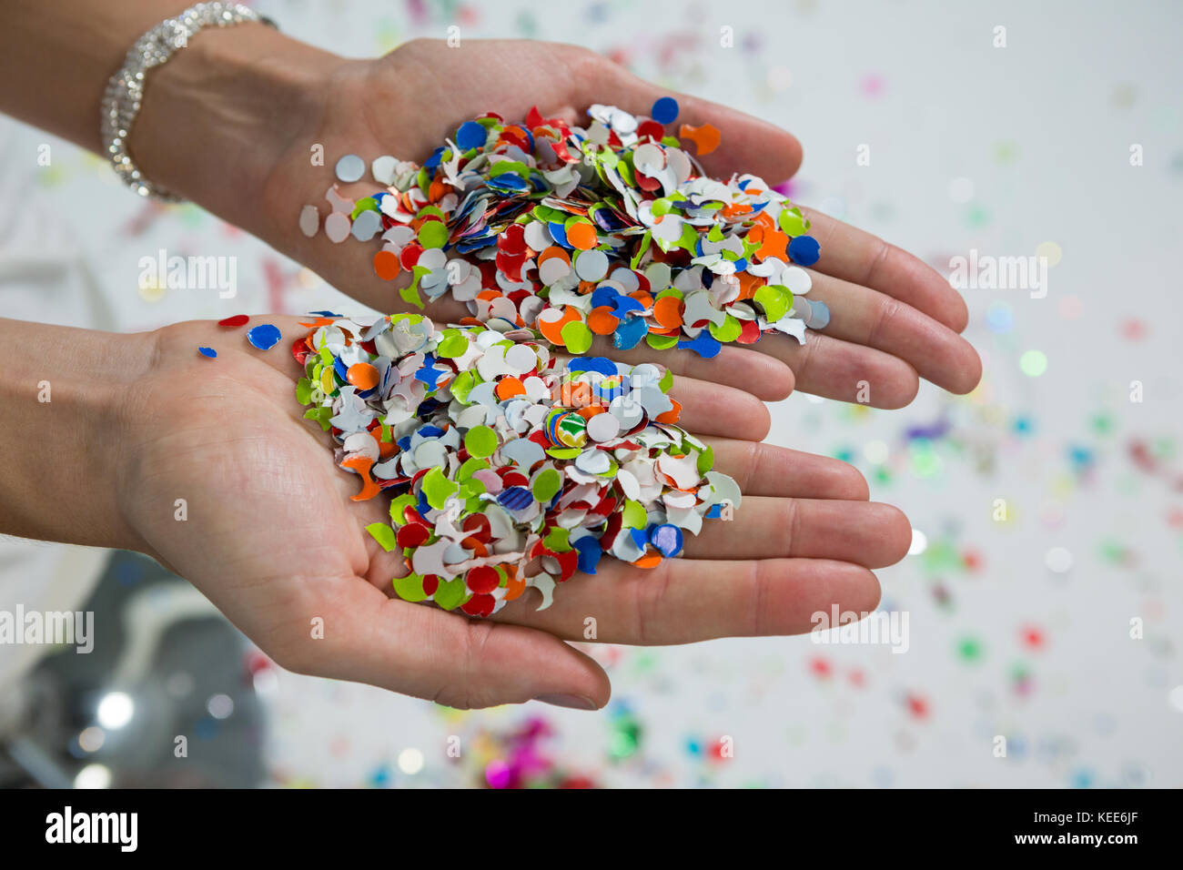 Hands and confetti hi-res stock photography and images - Alamy