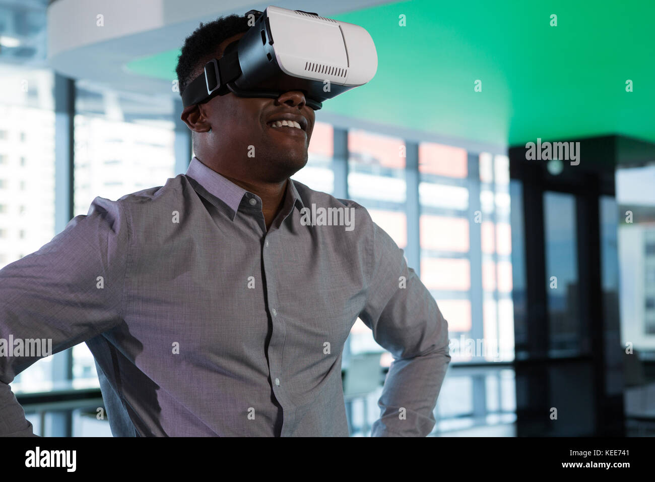 Man using virtual reality headset in futuristic office Stock Photo - Alamy