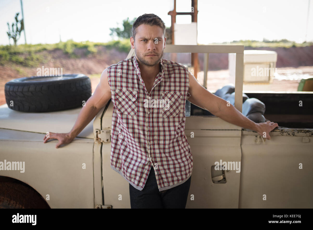 Portrait of man standing near his car Stock Photo - Alamy