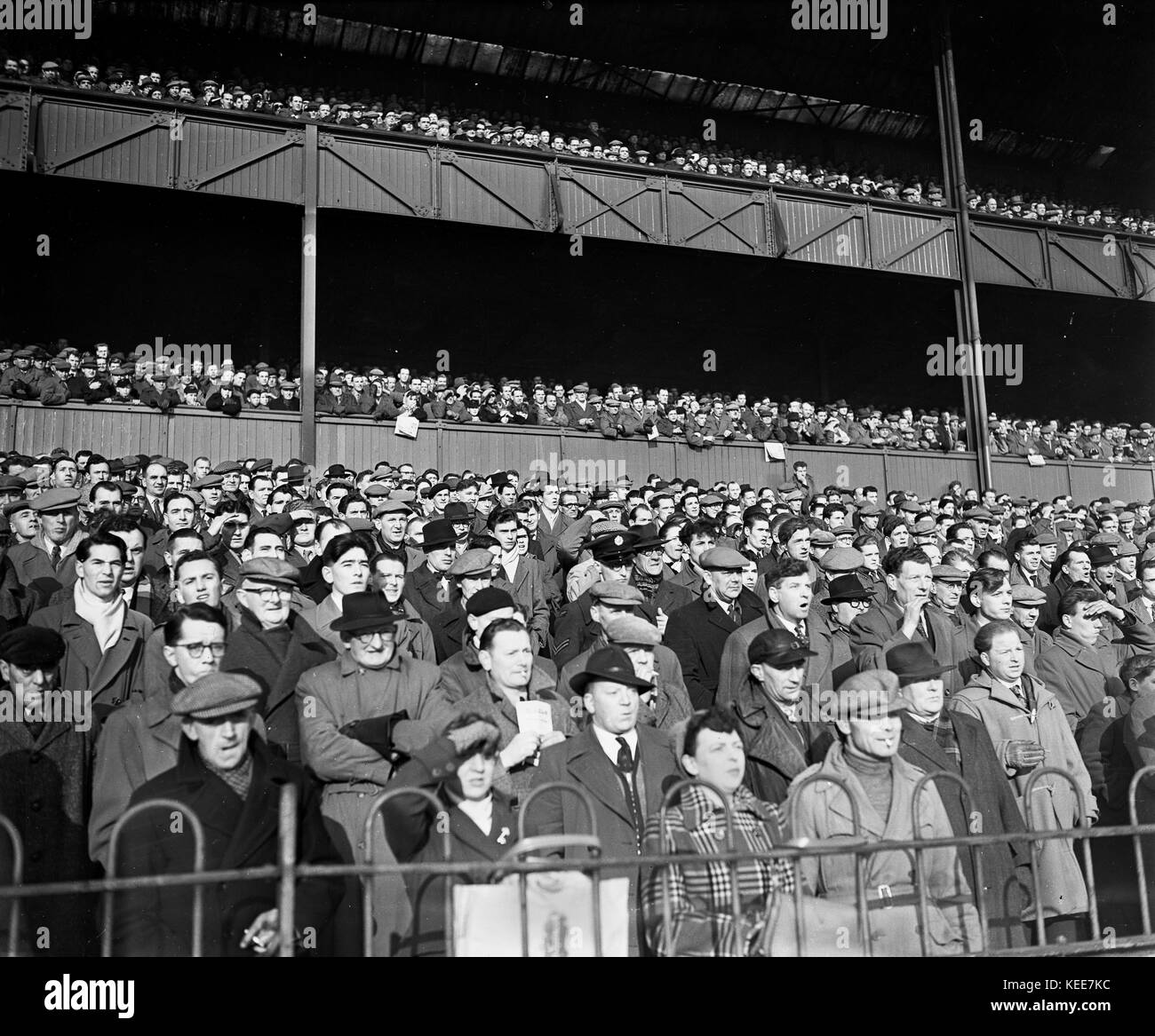 Derby County fans faces in the crowd in attendance at the Osmaston End of the Baseball Ground c1955.  Photograph by Tony Henshaw   *** Local Caption *** From the original glass negative From the wholly-owned original negative. Stock Photo