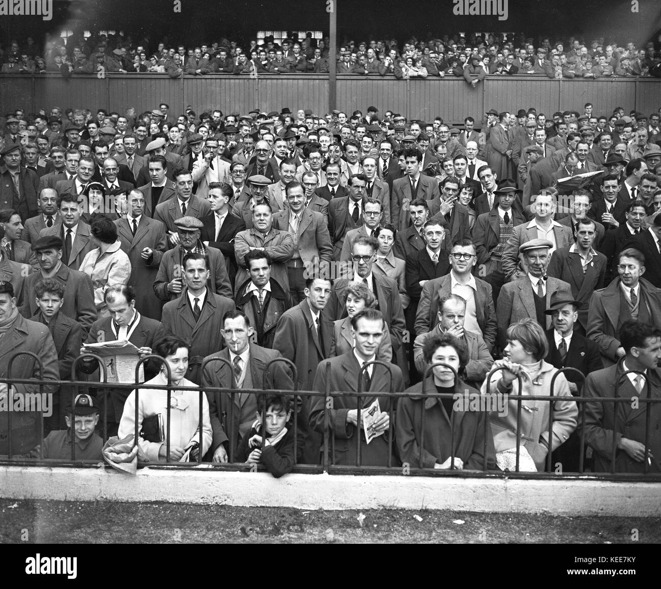 Derby County fans faces in the crowd in attendance at the Osmaston End of The Baseball Ground c1955.  Photograph by Tony Henshaw *** Local Caption *** From the original glass negative From the wholly-owned original negative. Stock Photo
