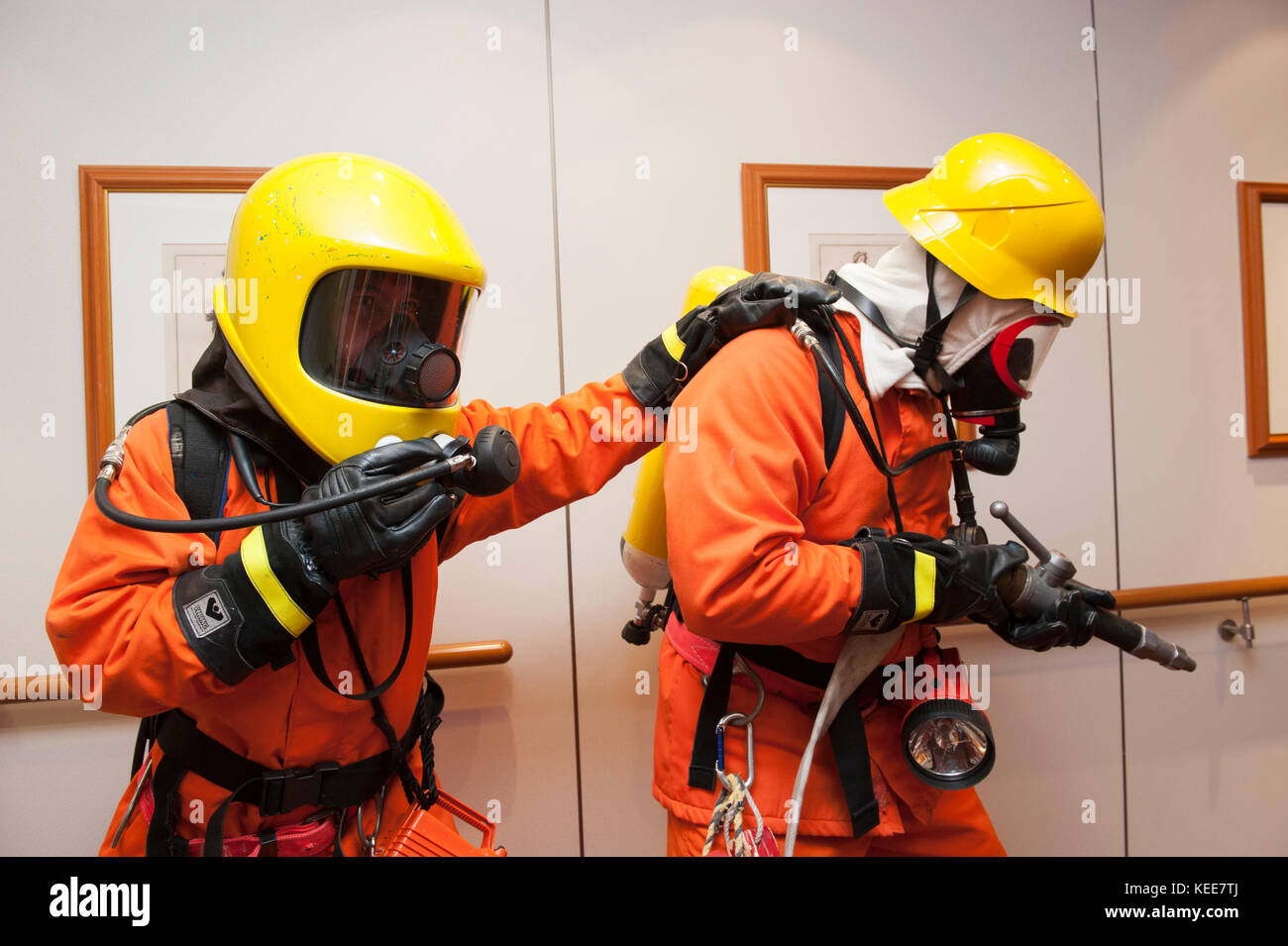 Crew firefighting practice on board a cruise ship Stock Photo