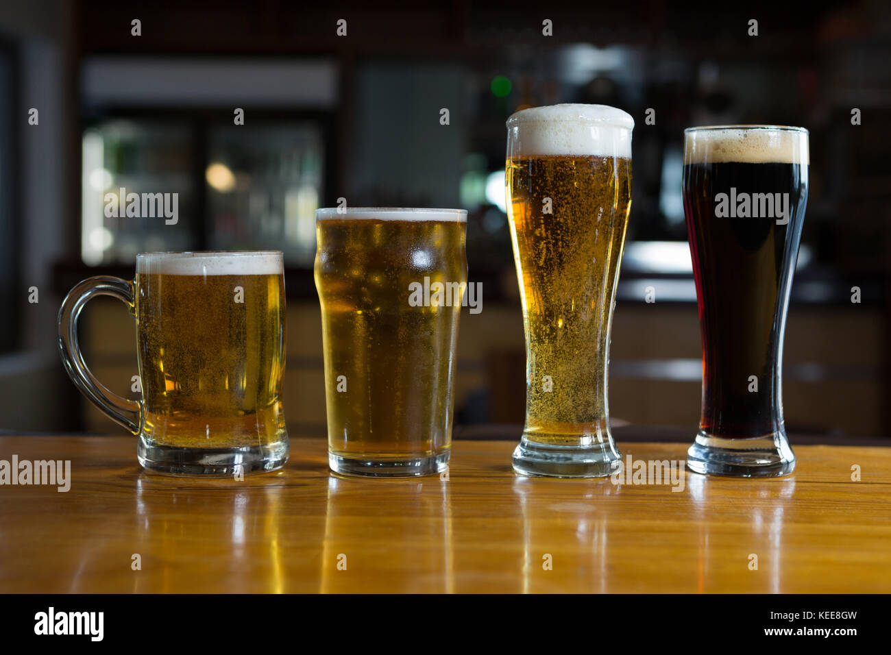 Close-up of beer glasses on the counter in bar Stock Photo
