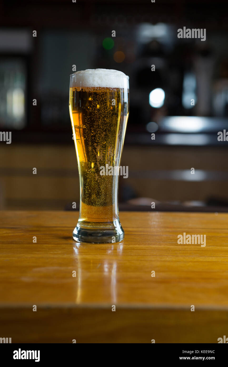 Close-up of beer glass on the counter in bar Stock Photo