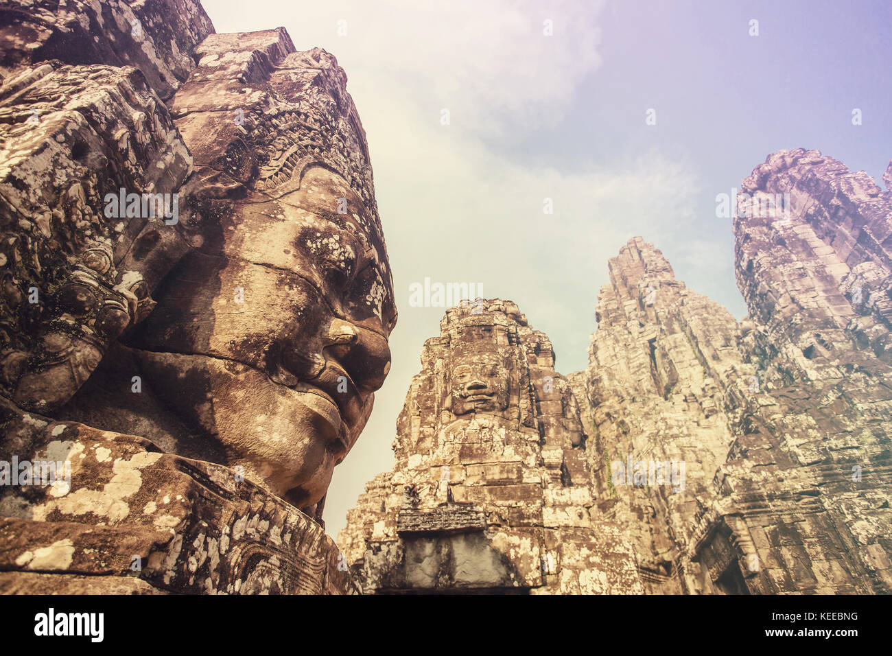 Stone Faces On The Towers Of Ancient Bayon Temple In Angkor Thom ...