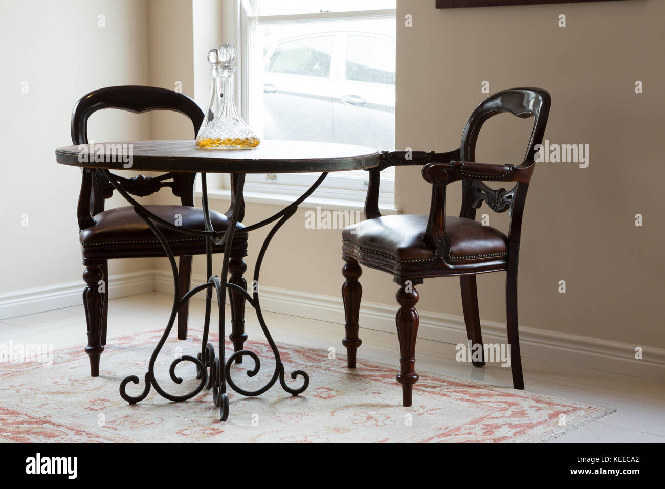 Round table and chairs in living room at home Stock Photo Alamy
