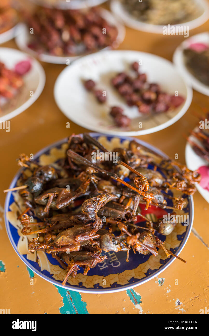 Deep fried chickens on sticks in Myanmar. Burmese traditional snacks Stock Photo