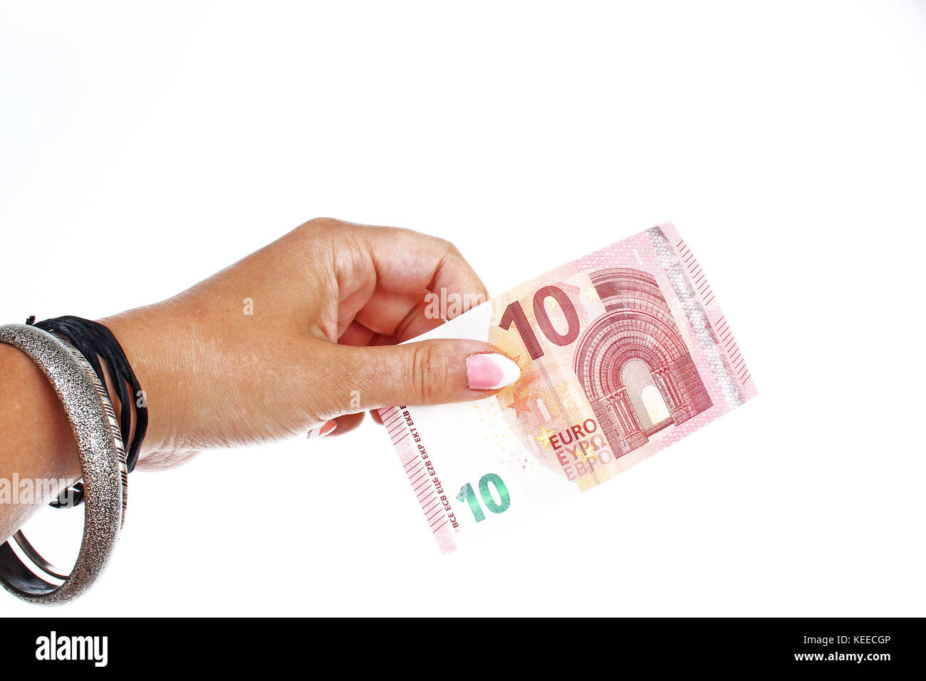 Woman hand holding euro money bill on isolated white cutout background ...