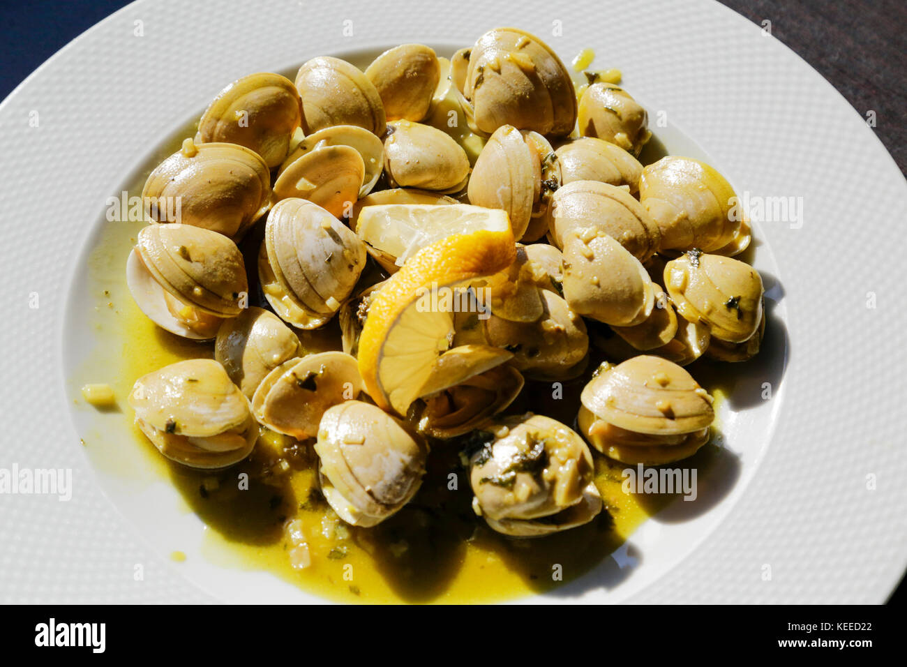 Plate of traditional Portuguese clams in garlic Amêijoas à Bulhão