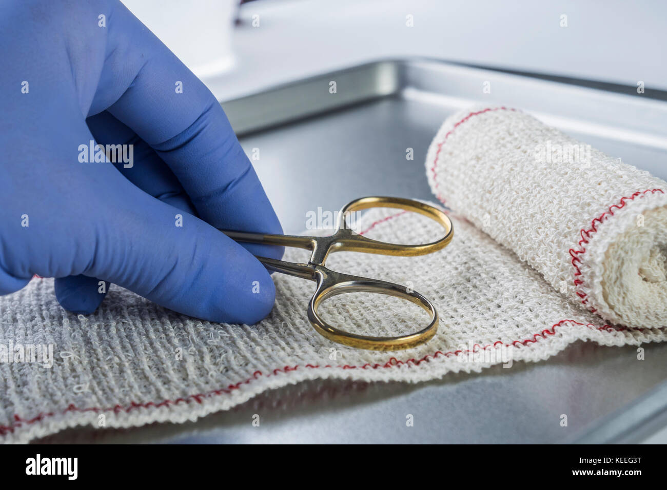 Surgical Scissors On A Bandage, Conceptual Image Stock Photo Alamy