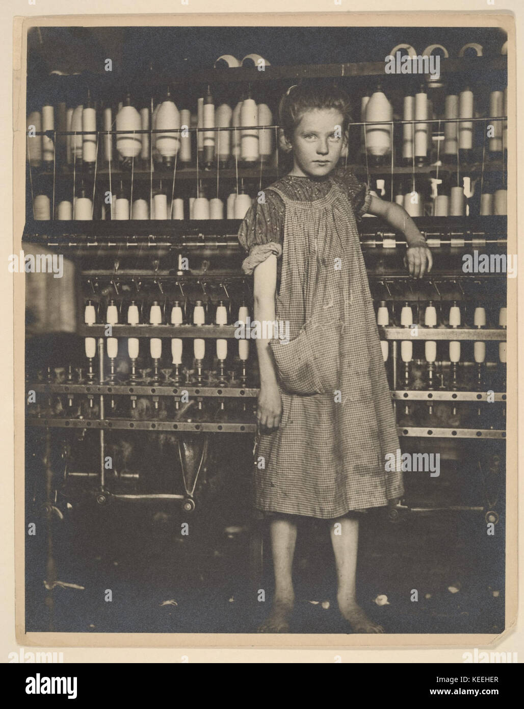Addie Card, 12 years. Spinner in North Pownal Cotton Mill. Girls in mill say she is ten years. She admitted to me she was twelve; that she started during school vacation and now would  stay . Location  Vermont MET 0112 Stock Photo