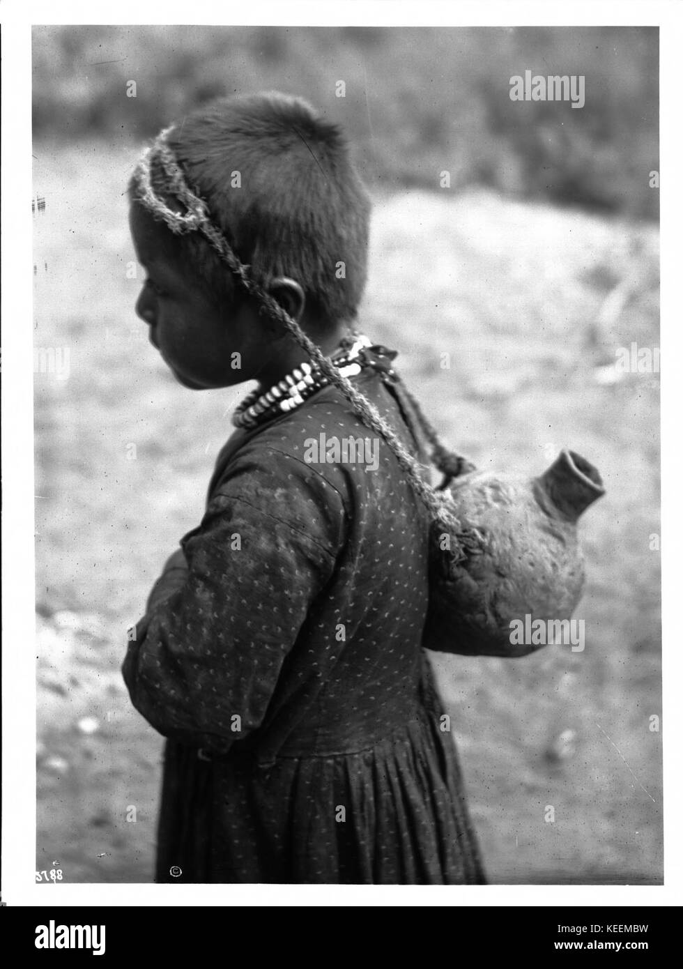 Young Havasupai Indian girl, Waluthama's daughter, carrying an Olla or