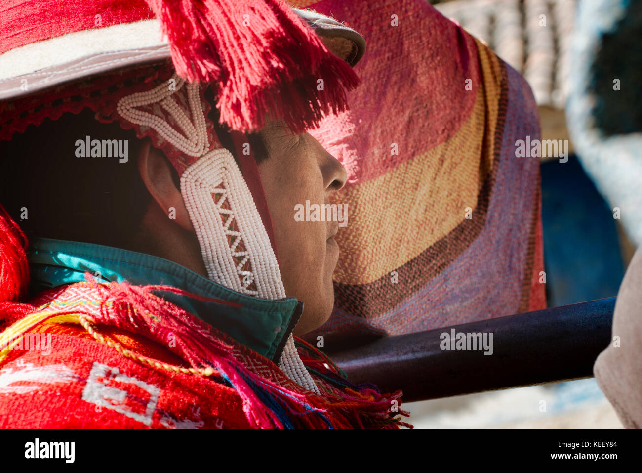 Close up profile of a peruvian man dressed in colourful traditional handmade outfit. October 21, 2012 - Patachancha, Cuzco, Peru Stock Photo