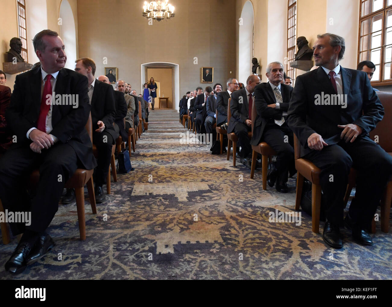 Prague's Charles University Rector Tomas Zima (left) will continue ...