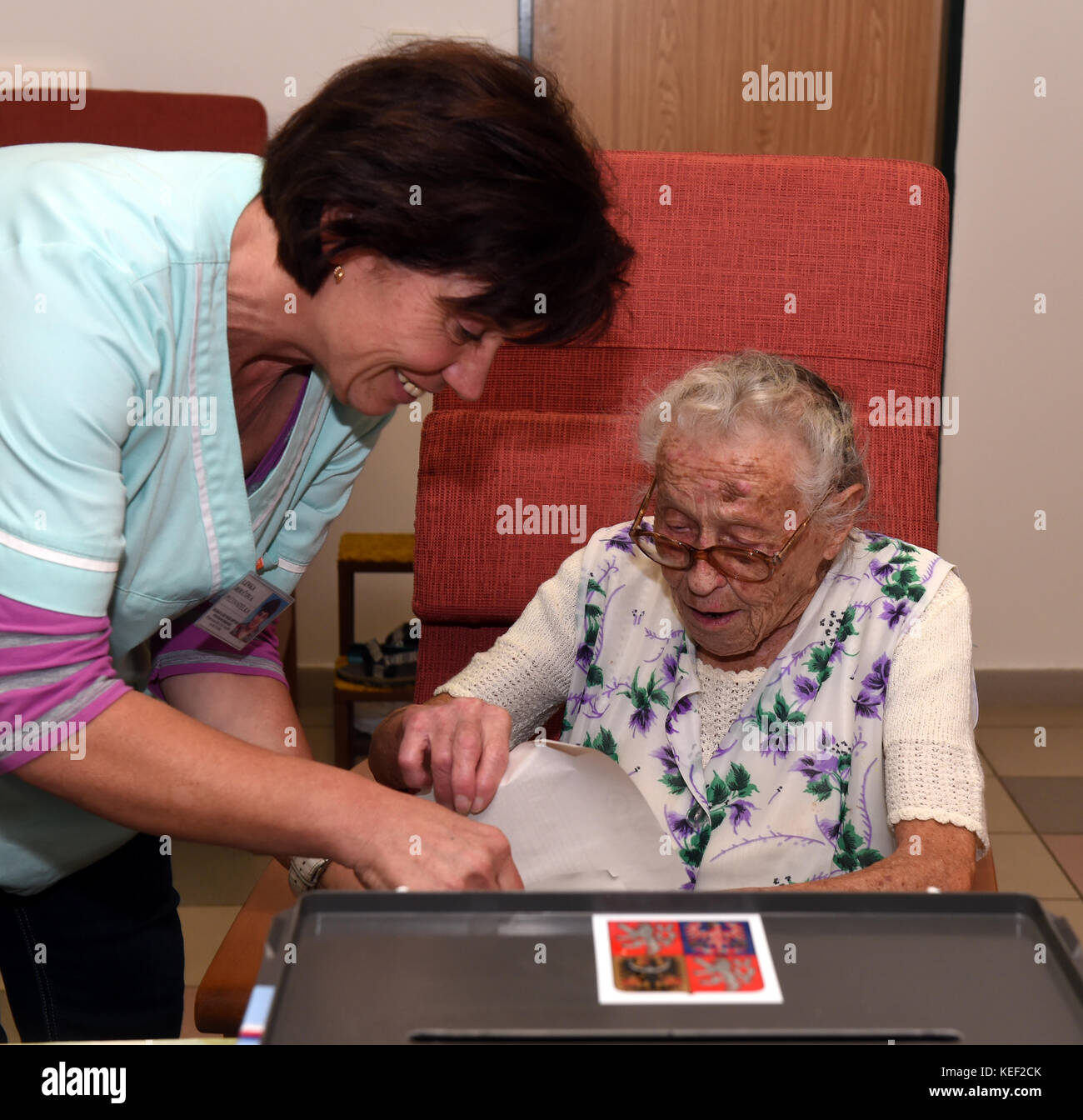 103 years old voter Anna Hejna (right) votes during elections to the Chamber of Deputies of the Parliament of the Czech Republic in a retirement home in Novy Bor, Czech Republic, on October 20, 2017. On left side of the photo is seen nurse Lenka Roucova. Czech general elections 2017 are held on October 20-21. (CTK Photo/Libor Zavoral) Stock Photo