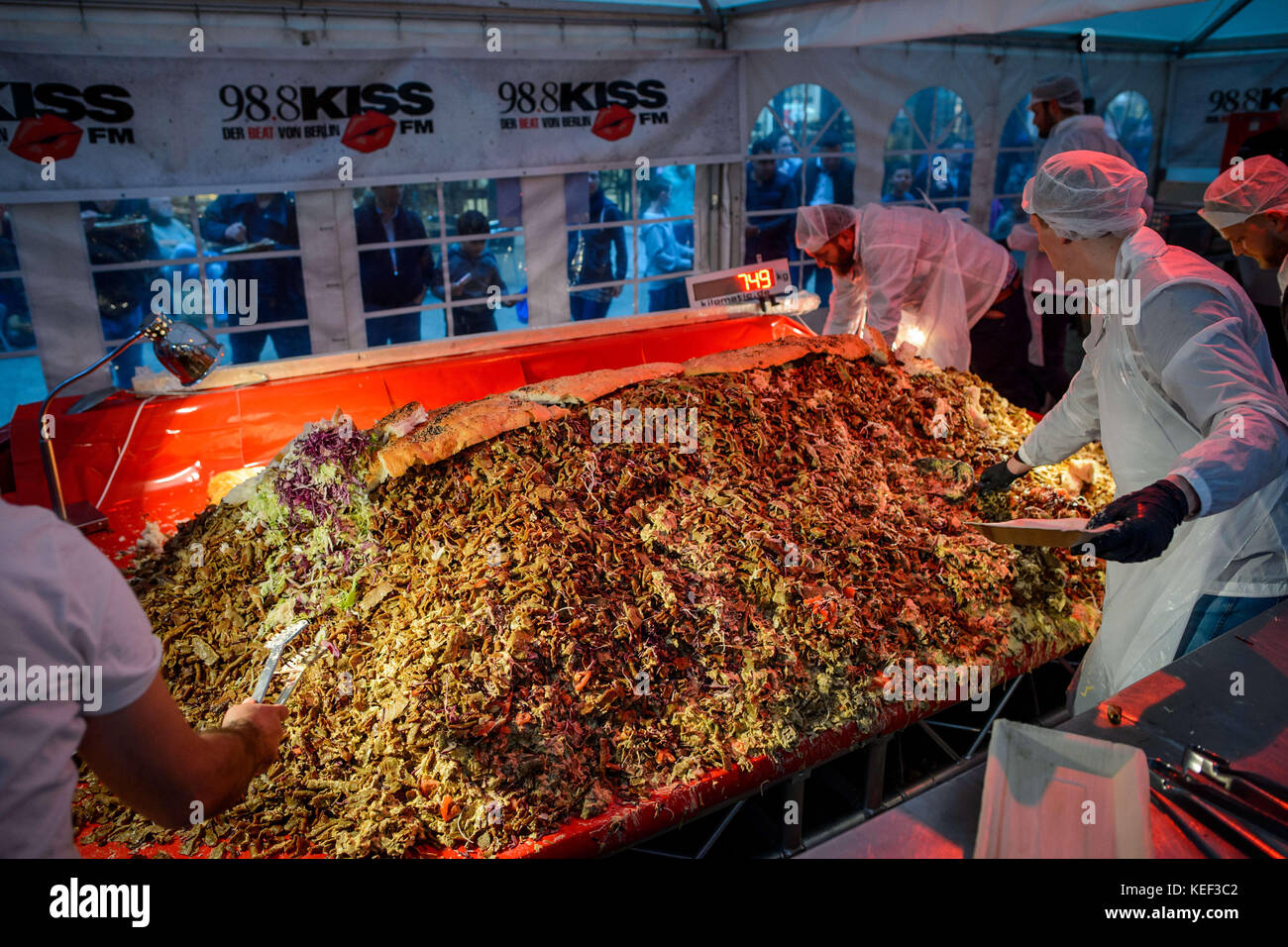 Staff from the Berlin private radio station "98.8 KISS FM" prepare to break  the record for the world's largest doner kebab in Berlin, Germany, 20  October 2017. The kebab broke the record,