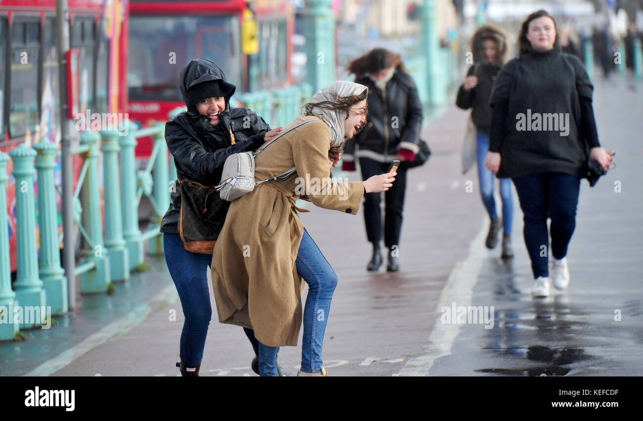 Brighton, UK. 21st Oct, 2017. UK Weather. Young women enjoy themselves