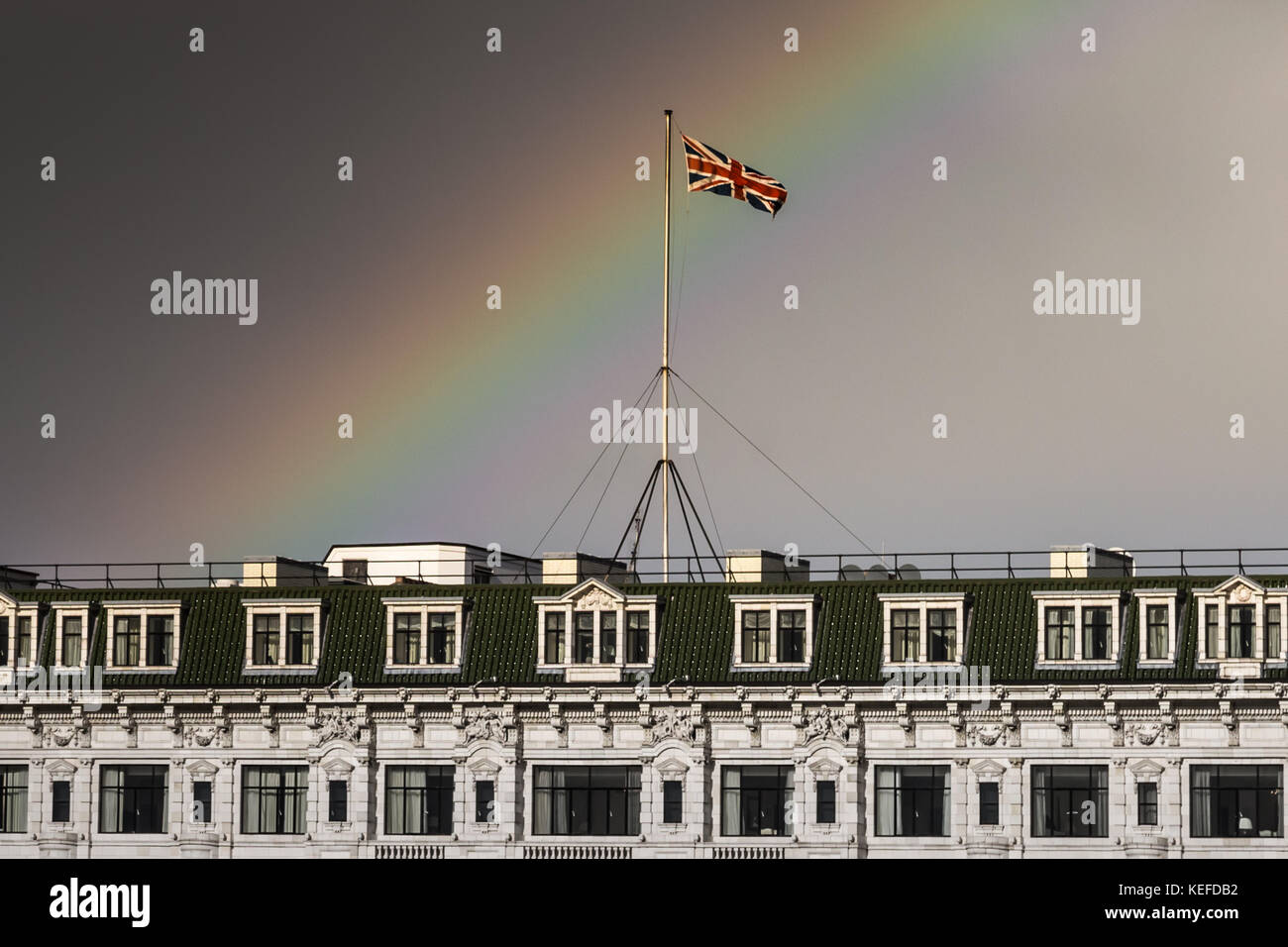 London, UK. 21st Oct, 2017. UK Weather: Storm Brian brings a rainbow over the Savoy Hotel. Credit: Guy Corbishley/Alamy Live News Stock Photo
