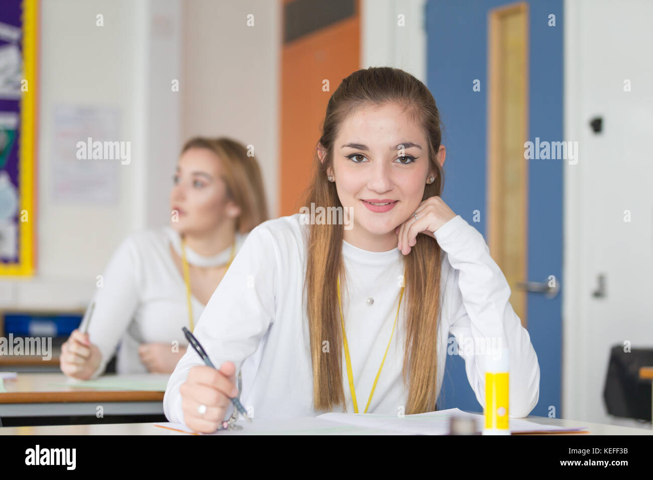 Pretty sixth form student enjoying her school lesson UK Stock Photo