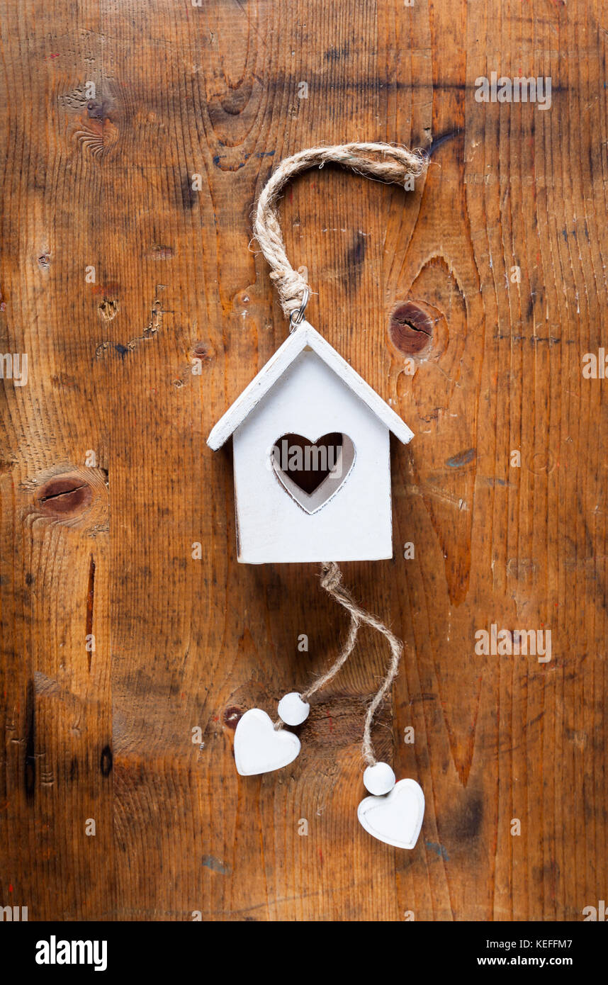 wooden house with a heart. home decor. concept of family and home Stock Photo