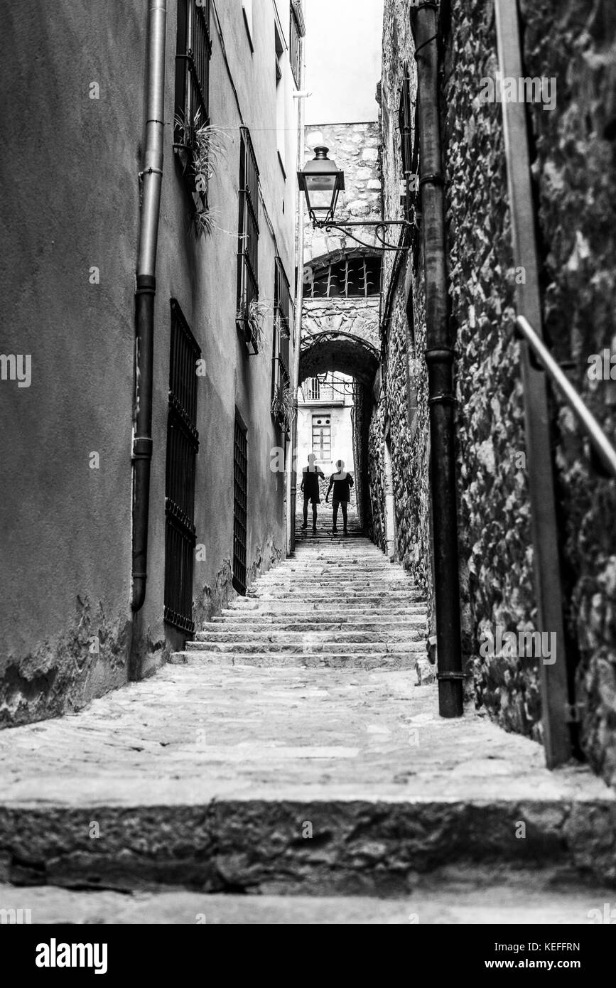 Boys runing in the street of the Girona, Catalonia, Spain, Europe. Stock Photo