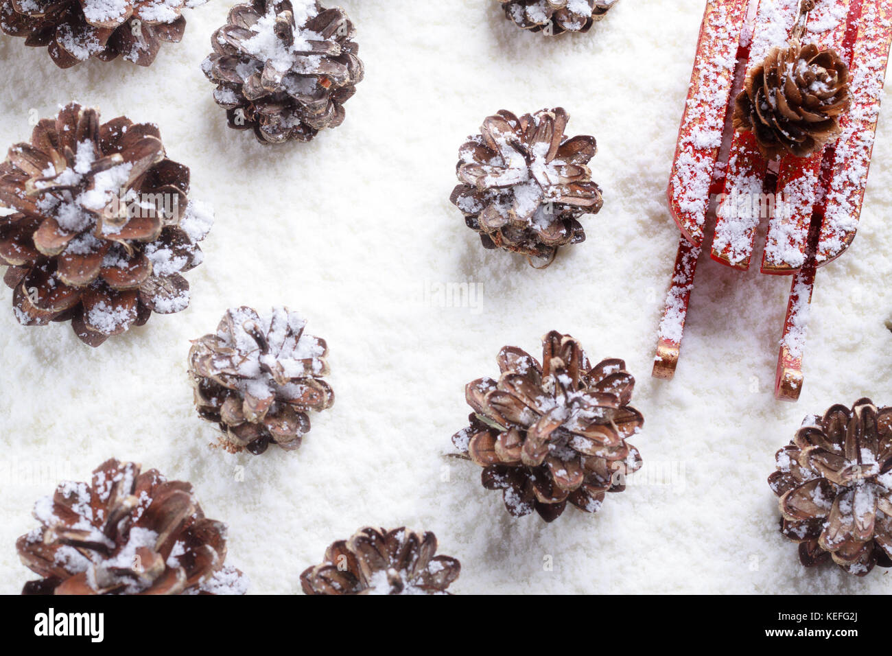 Christmas decoration, view from above for cone and sleigh frosted by snow. Stock Photo