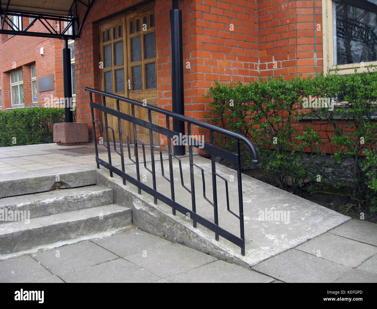 Building entrance with ramp for disabled person wheelchair Stock Photo Alamy