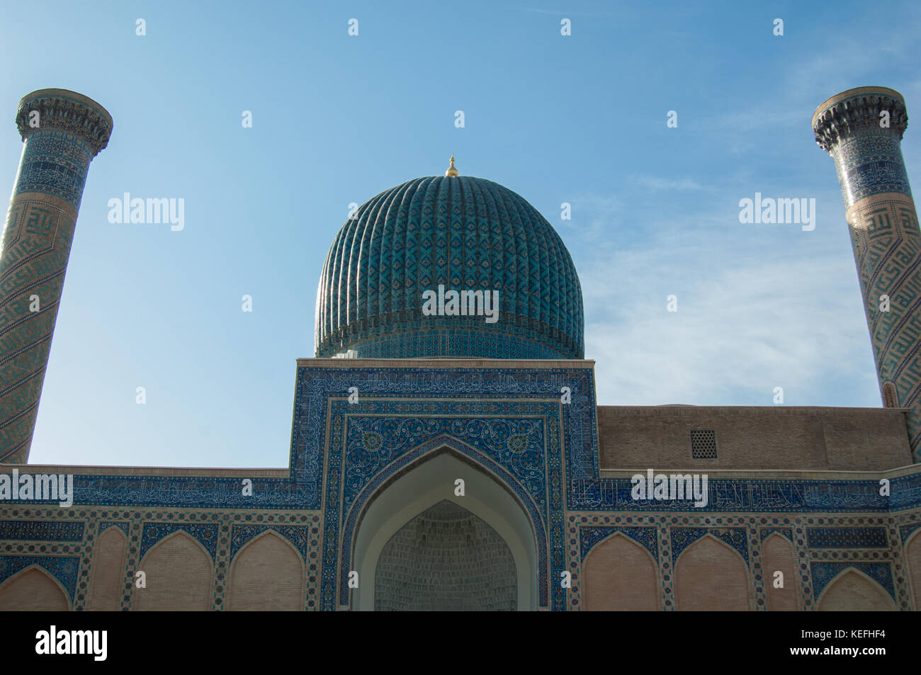 ancient Central Asian building with two columns and a tower. ancient ...