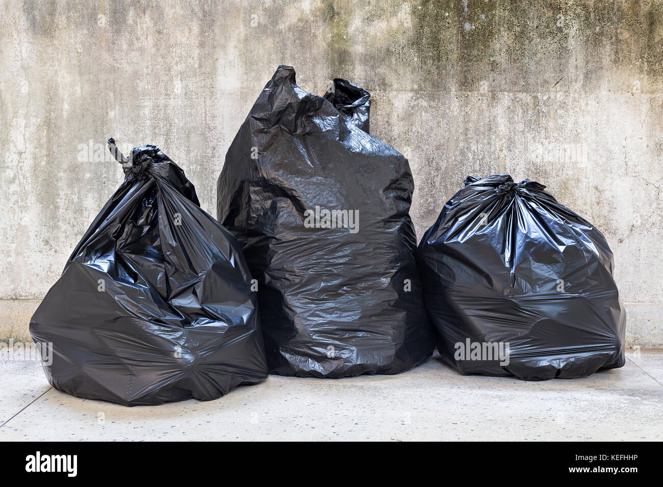 close-up of a full garbage bags on floor Stock Photo
