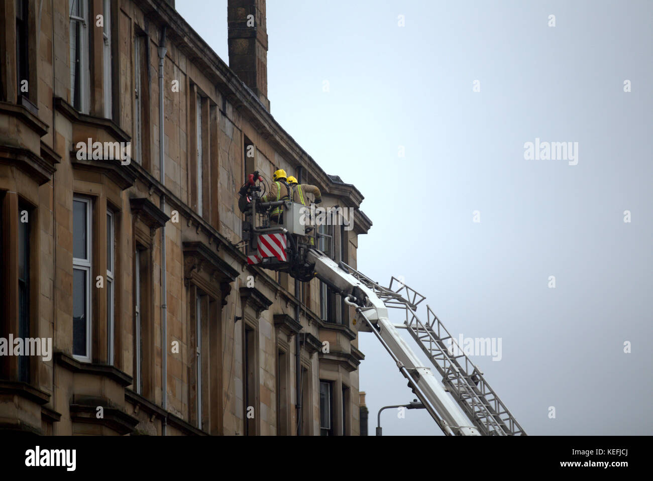 UK Weather, first damage of the bad weather in Great Western Road had traffic restrictions as fire crews and police make building safe Stock Photo