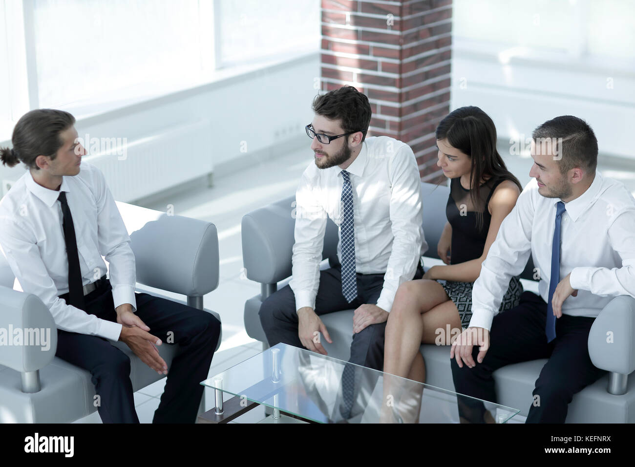 employees sitting in the lobby of the office Stock Photo - Alamy