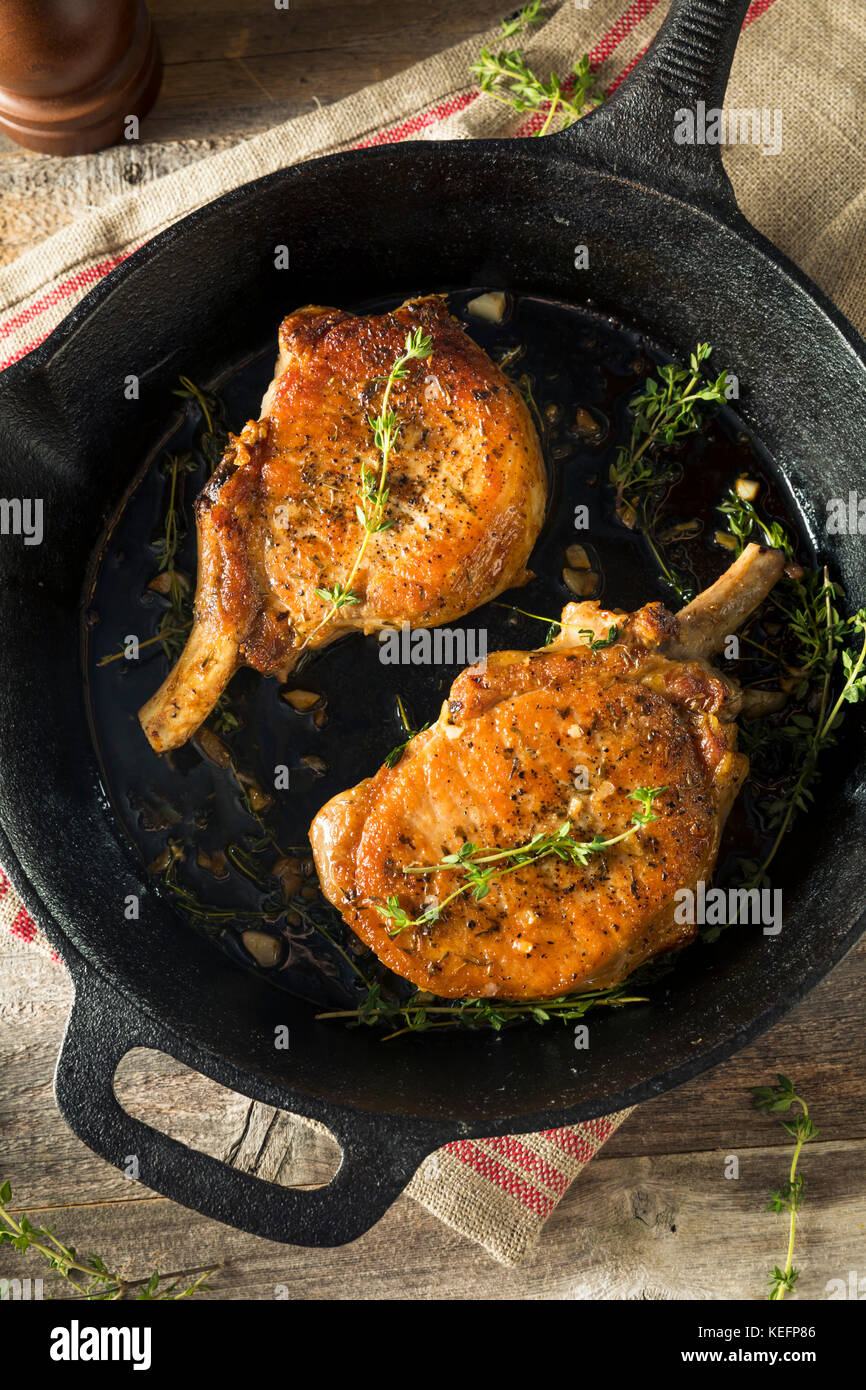 Homemade Roasted Bone in Pork Chop with Herbs and Spices Stock Photo