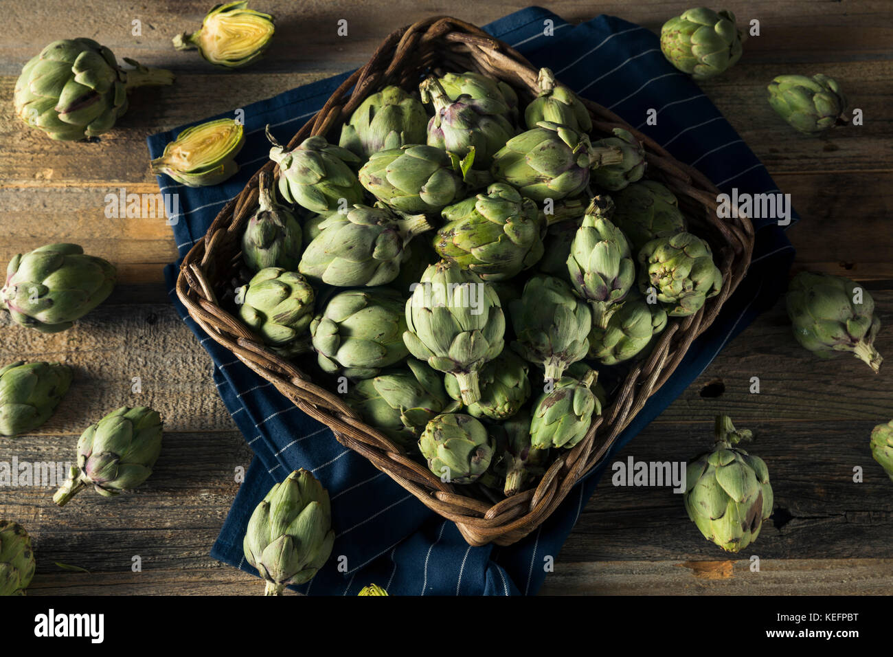 Healthy Raw Green Organic Baby Artichokes in a Basket Stock Photo Alamy