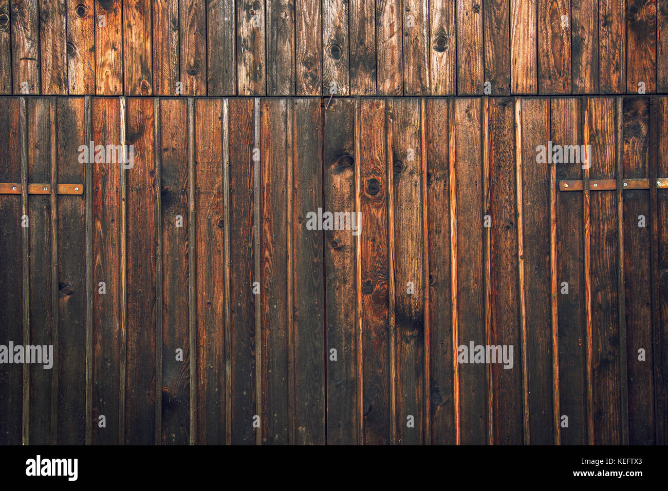 Wooden barn shed door as background or texture, typical traditional