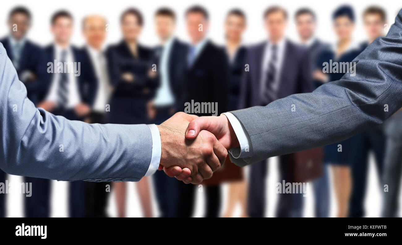 Handshake Front View Handshake in front of business people Stock Photo - Alamy