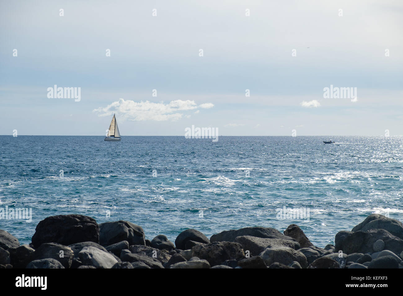 sail boat at horizon line Stock Photo - Alamy
