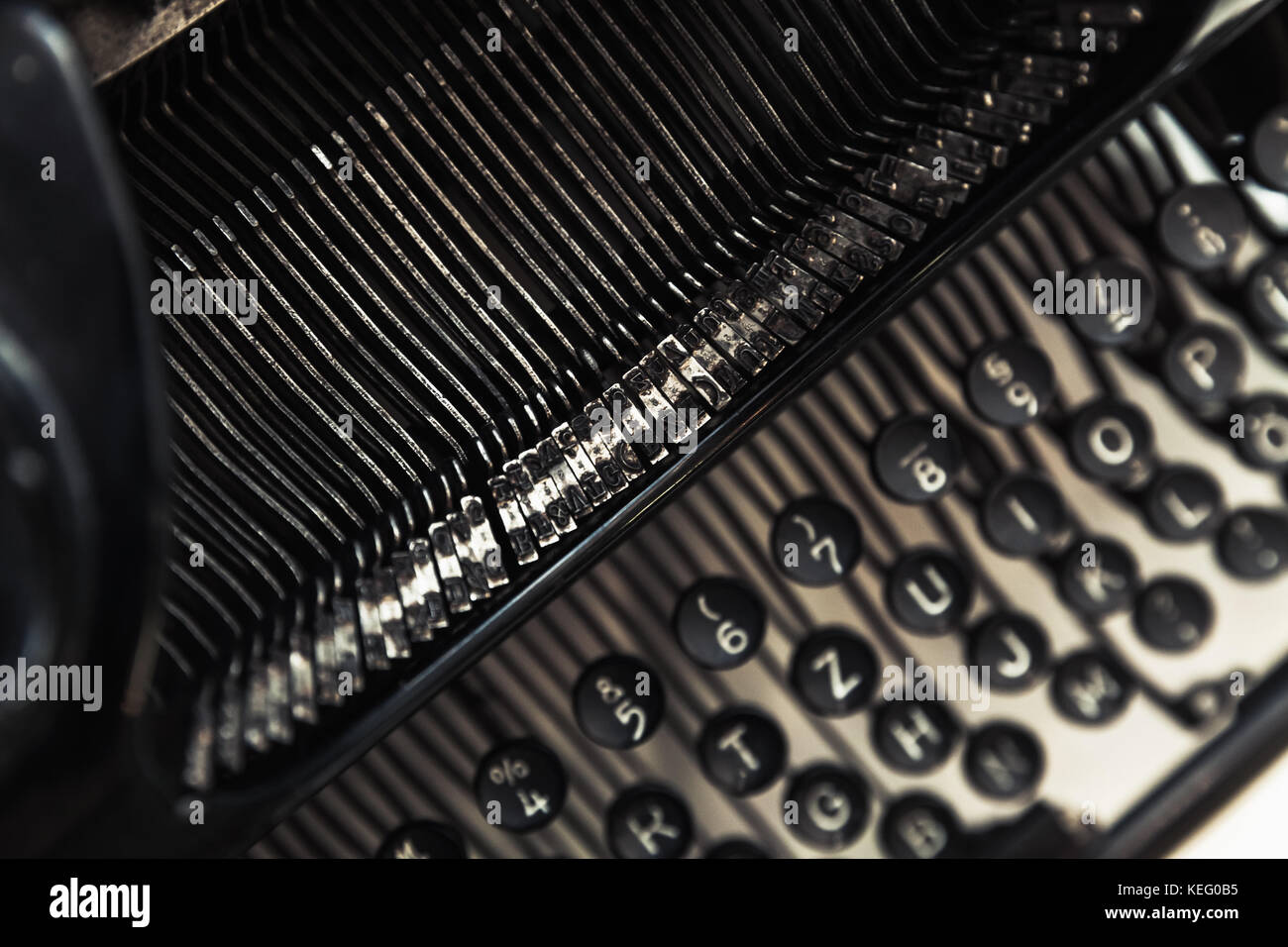 Vintage manual typewriter machine, closeup fragment with letters and