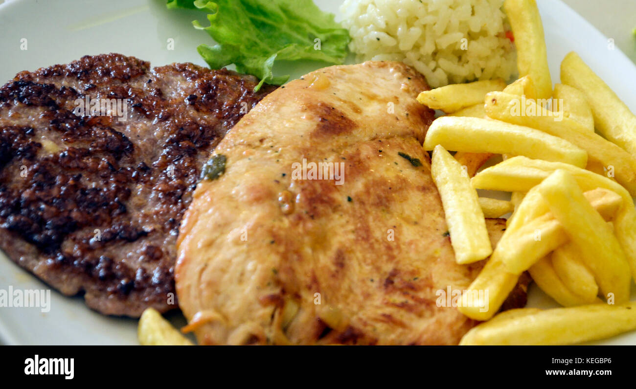 Picture of a Grilled chicken and burger Stock Photo