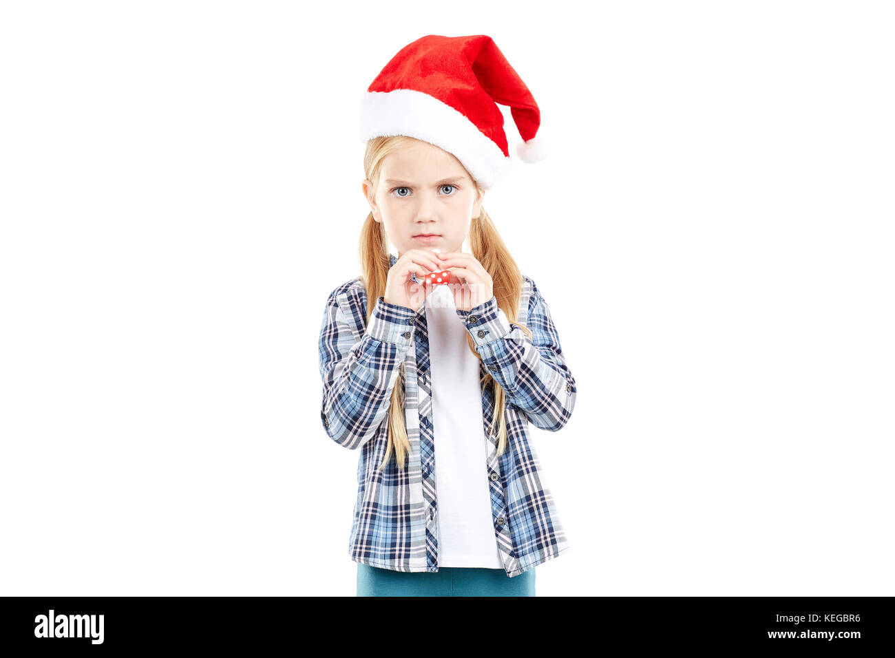 Santa girl with party blower Stock Photo - Alamy