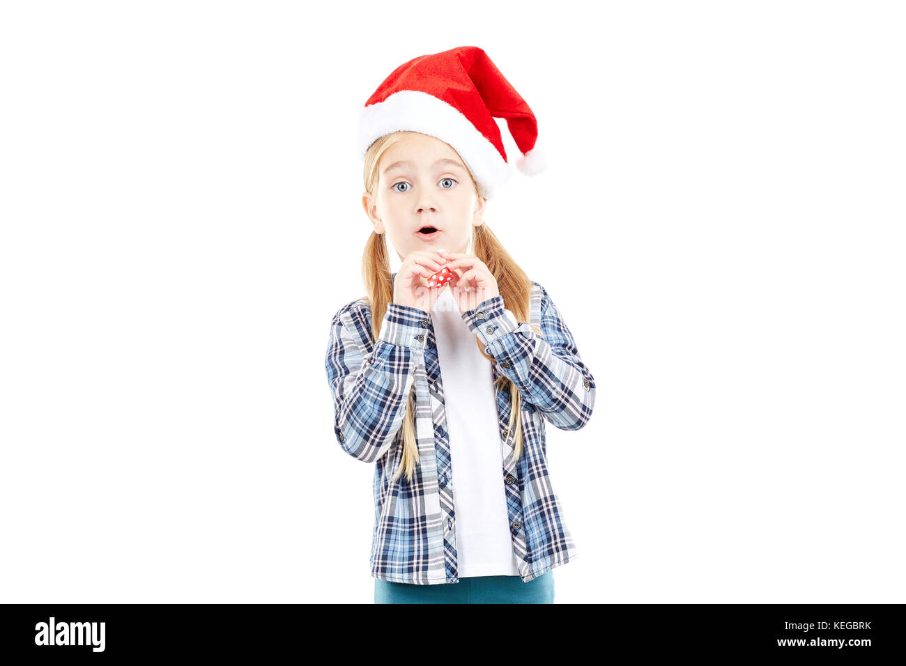 Santa girl with party blower Stock Photo - Alamy