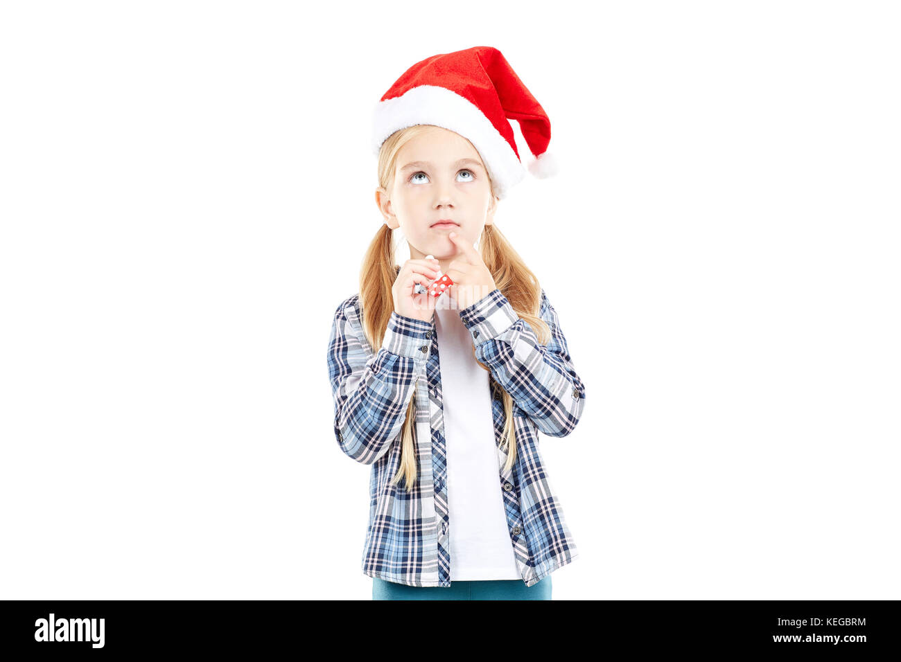 Santa girl with party blower Stock Photo - Alamy