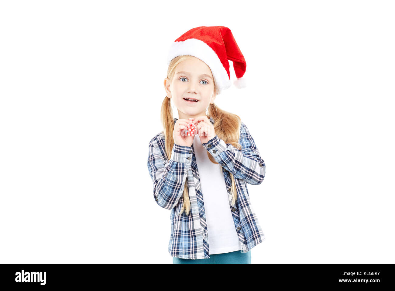 Santa girl with party blower Stock Photo - Alamy