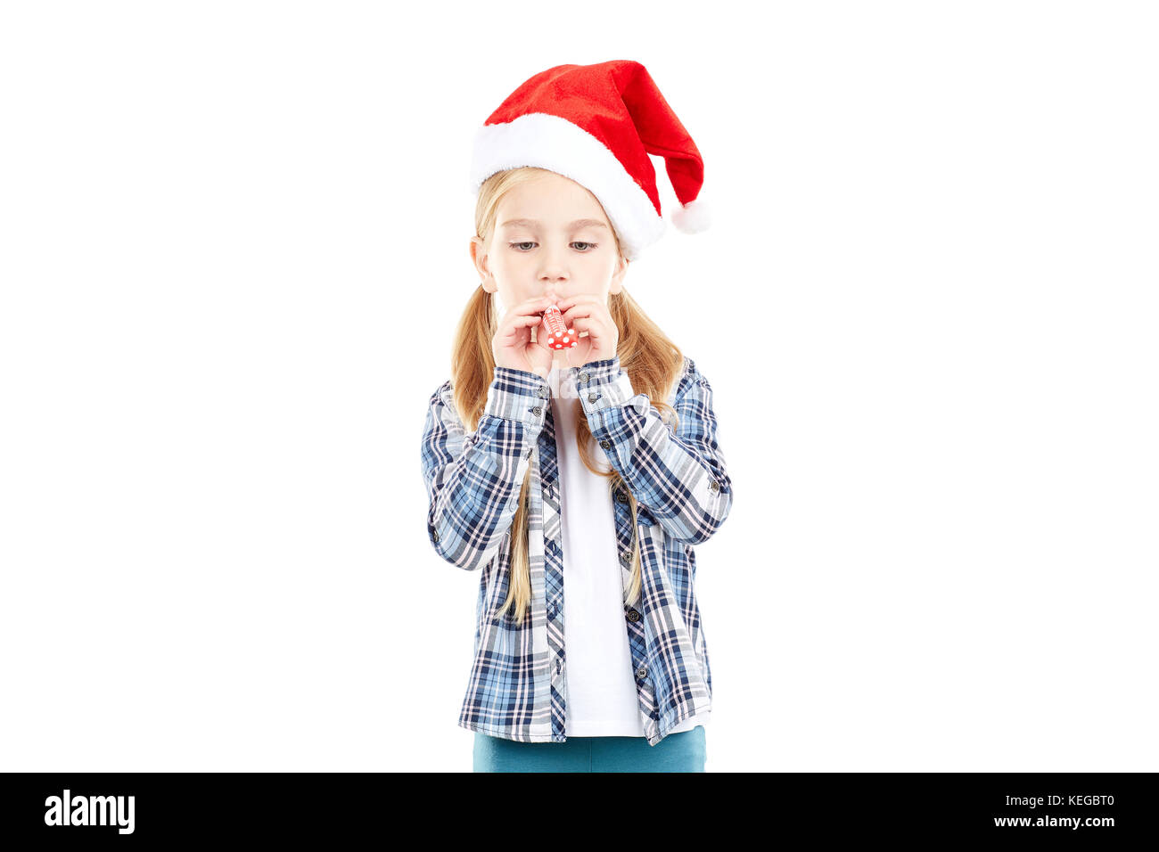 Santa girl with party blower Stock Photo - Alamy
