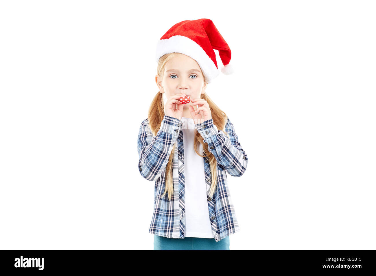 Santa girl with party blower Stock Photo - Alamy