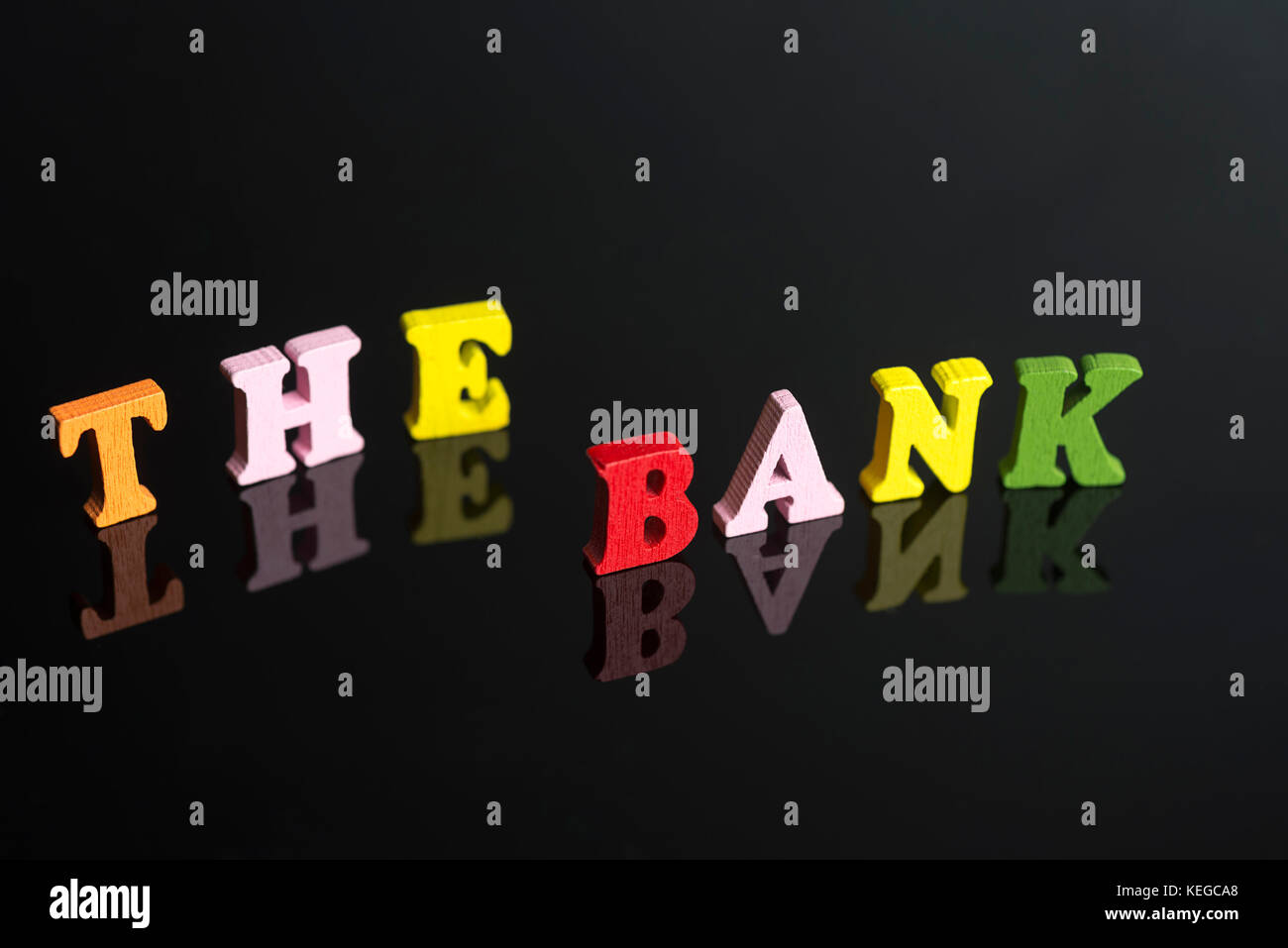 Word Bank Lettering A word Bank of colored letters on black background Stock Photo - Alamy