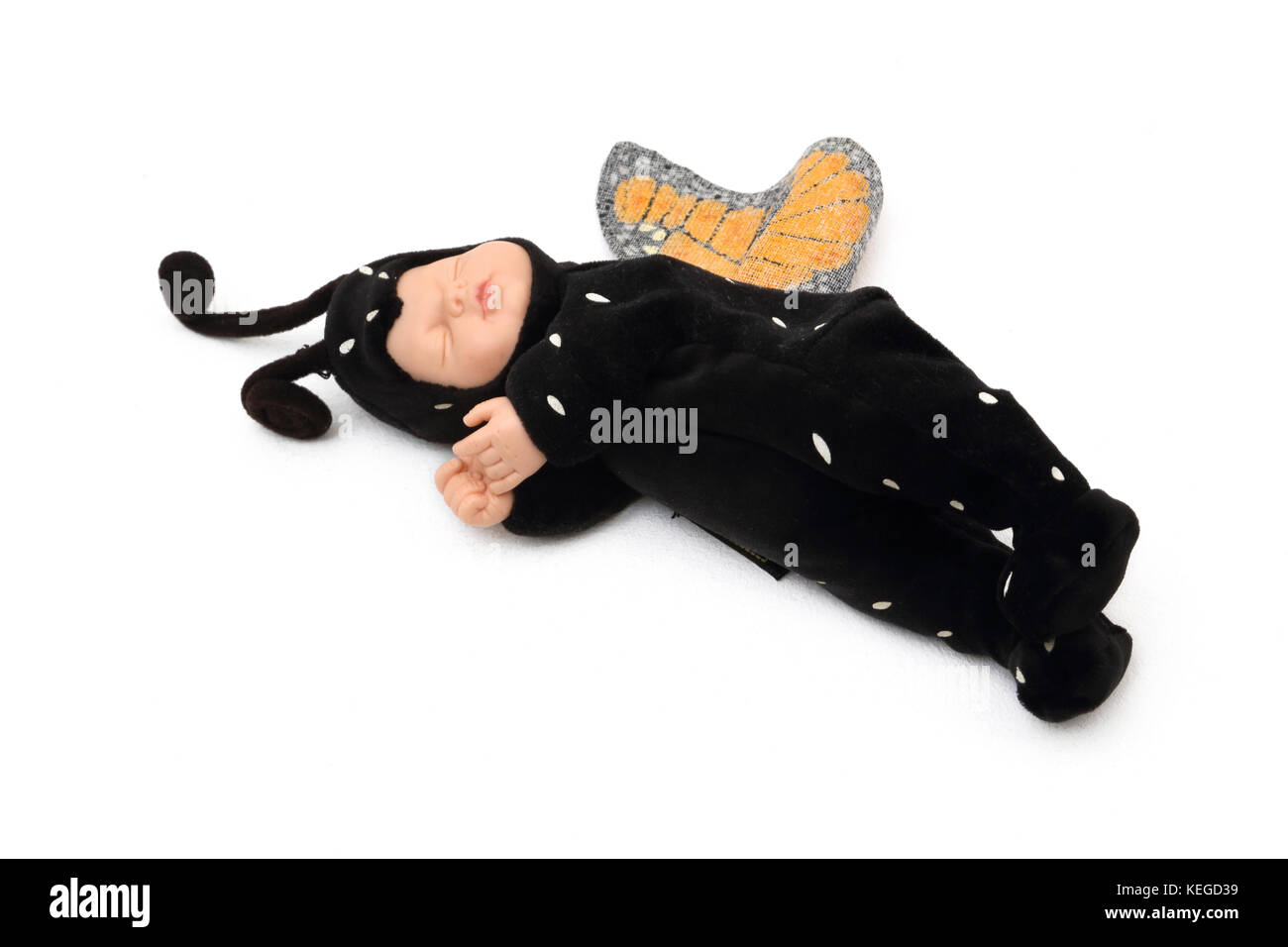 Baby Doll Toy in Butterfly Costume Stock Photo