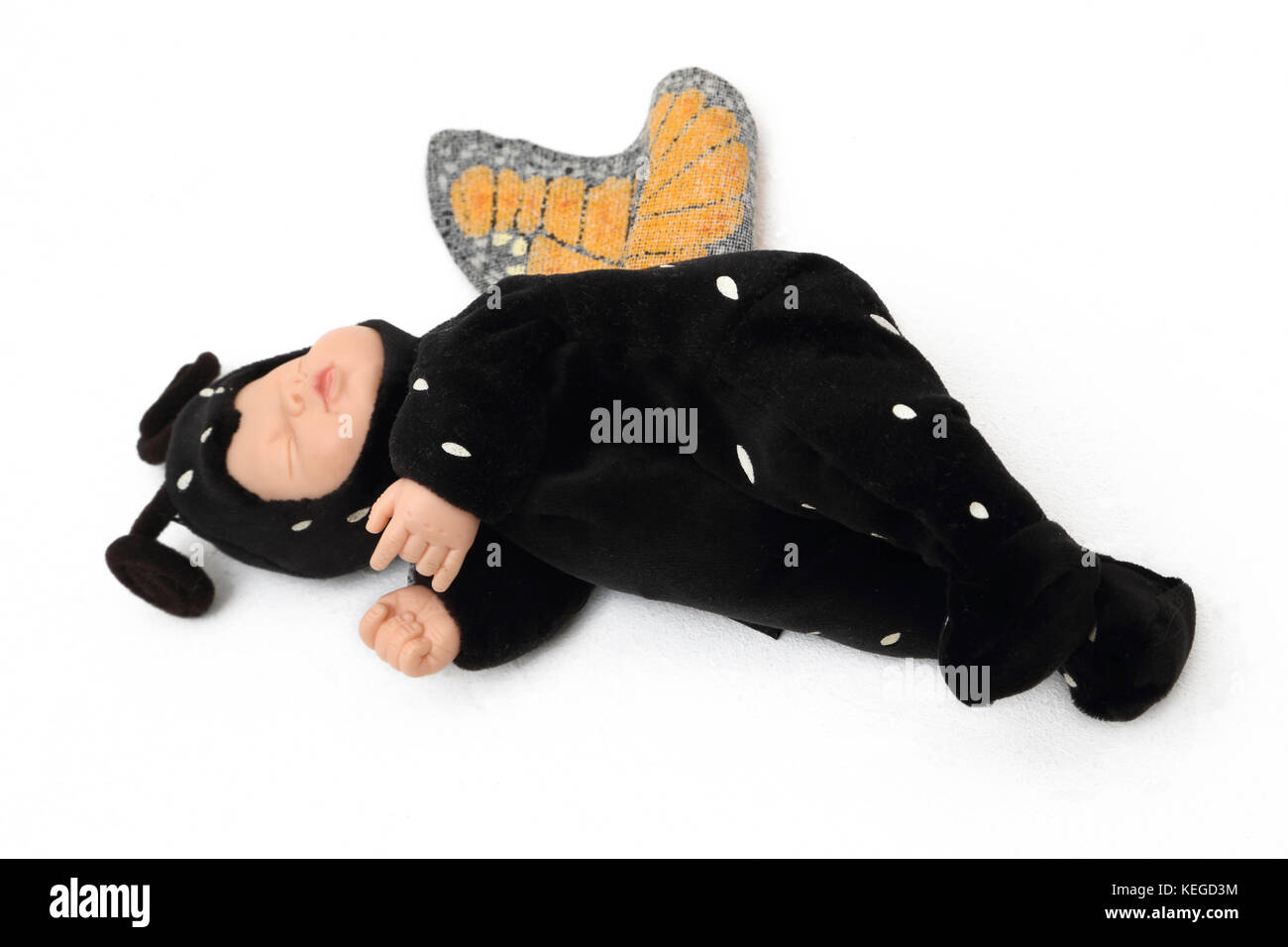 Baby Doll Toy in Butterfly Costume Stock Photo